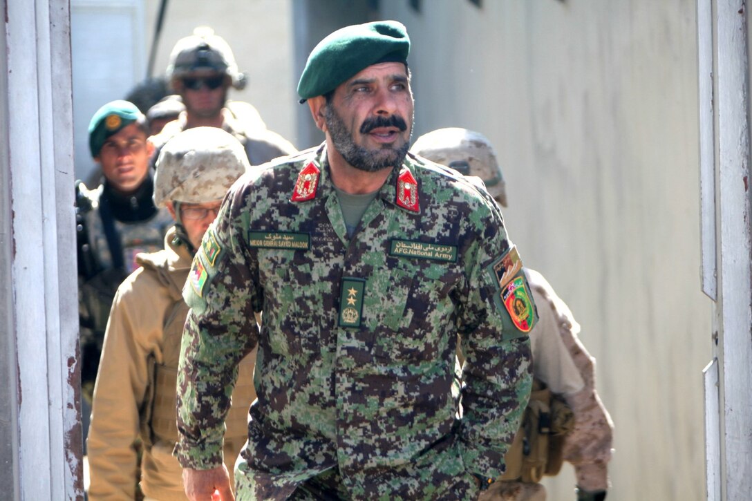 Major Gen. Sayeed Malook, commanding general of the Afghan National Army's 215th Corps, arrives at Main Operating Base Lashkar Gah following a shura at the Provincial Police Headquarters, Lashkar Gah, Helmand province, Afghanistan, Feb. 10, 2014. Major Gen. Malook attended the shura to brief the provincial governor of Helmand on the ANA's progress in the Sangin Valley during the last few weeks and to discuss security in the province for the upcoming Afghan national elections.
