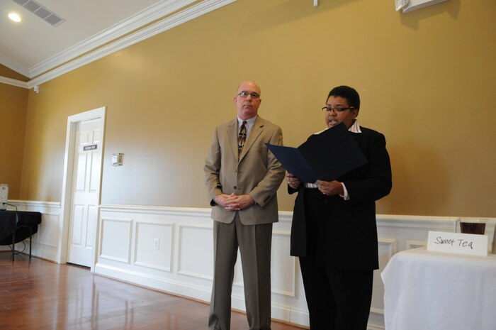 Colleen Morehead, general manager for Lincoln Military Housing’s Mid-Atlantic Region, reads from an official statement before presenting Oscar Almond with Lincoln’s Partner of the Year award during a ceremony at the Lincoln Military Housing Family Center on Feb. 10, 2014. Almond was one of eight nominated for the award. 