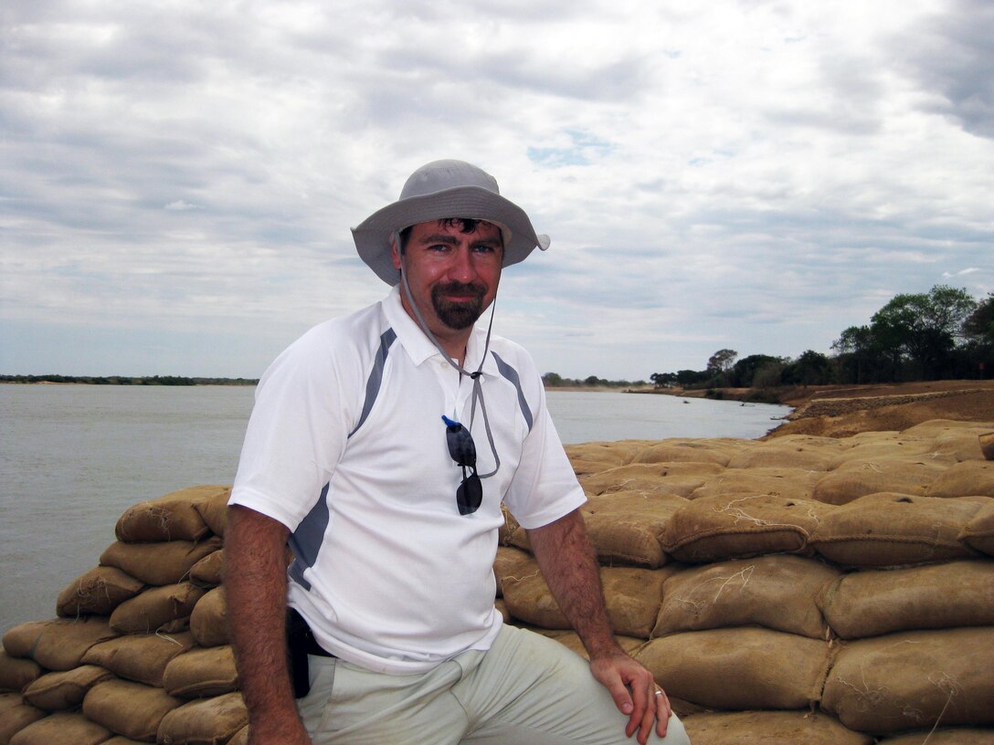 Kurt Heckendorf, engineering and construction division, stands in front of a constructed deflector at the project Ilha Tapera, near Barra, Bahia, Brazil.