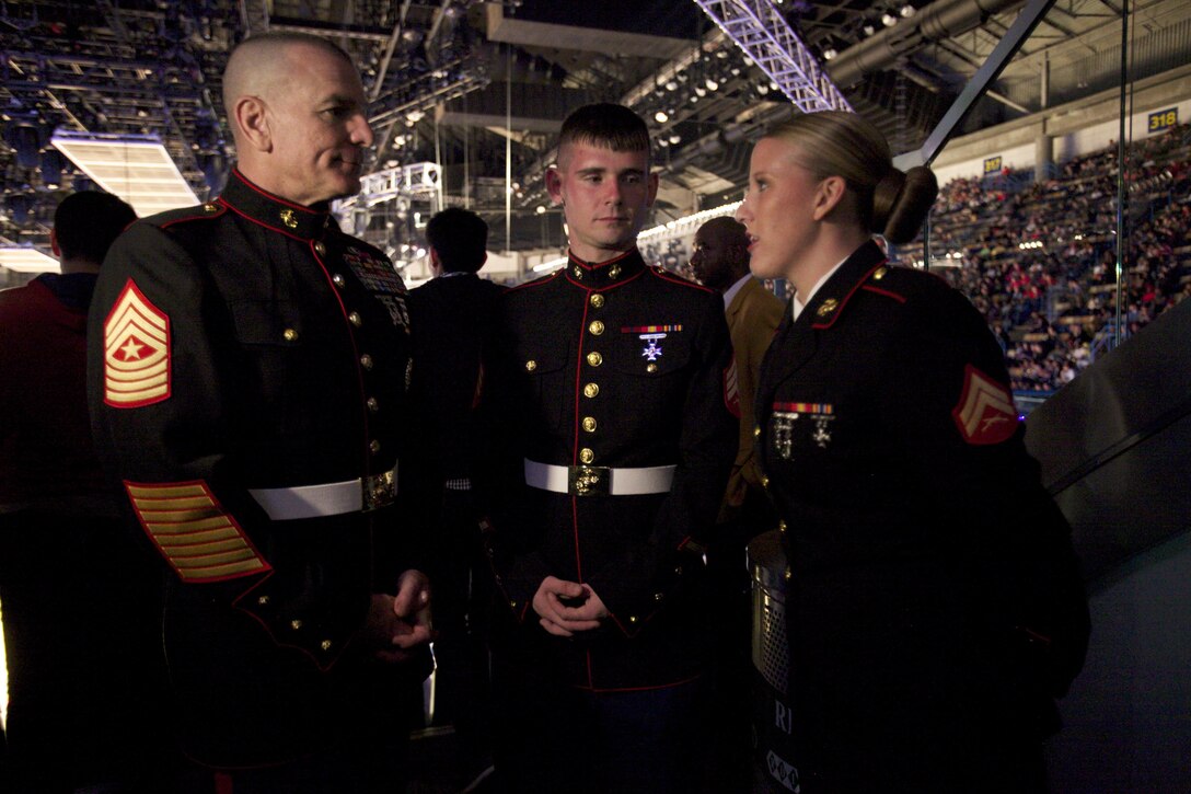 NEW ORLEANS – Marine Sgt. Maj. Bryan B. Battaglia greets Sgt. Michael Michelli, fiscal noncommissioned officer-in-charge, 4th Marine Logistics Group, Marine Forces Reserve and Cpl. Jessica E. Wirth, helicopter mechanic with Marine Aircraft Group 49, Detachment C, HMLA 773 Det. A, 4th Marine Aircraft Wing, MARFORRES, during the NBA All-Star Game, Feb. 16, 2014. Battaglia, the senior enlisted advisor to the chairman of the Joint Chiefs of Staff, the senior noncommissioned officer of the armed forces was recognized at the beginning of game as the honored guest and official representative of the U.S. military. (U.S. Marine Corps photo by Cpl. Tiffany Edwards)