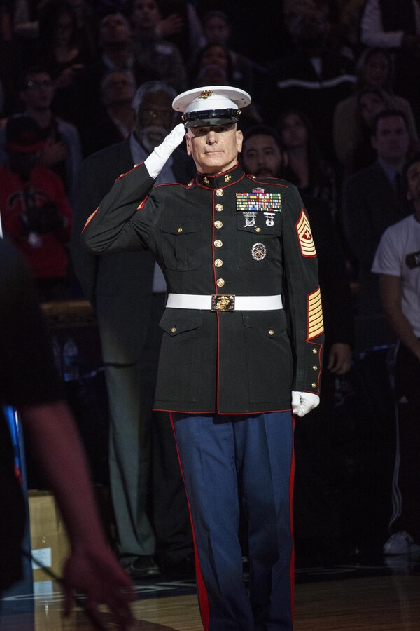U.S. Marine Sgt. Maj. Bryan Battaglia, 2nd Senior Enlisted Advisor to the Chairman of the Joint Chiefs of Staff, is honored during the National Anthem at the NBA All-Star Game inside the Smoothie King Center, New Orleans, La., Feb. 16, 2014. The Armed Forces community had the opportunity to participate in the 2014 NBA All-Star Weekend to highlight the military presence in the New Orleans area and support community outreach events. (U.S. Marine Corps photo by Lance Cpl. Mackenzie Schlueter/Released)
