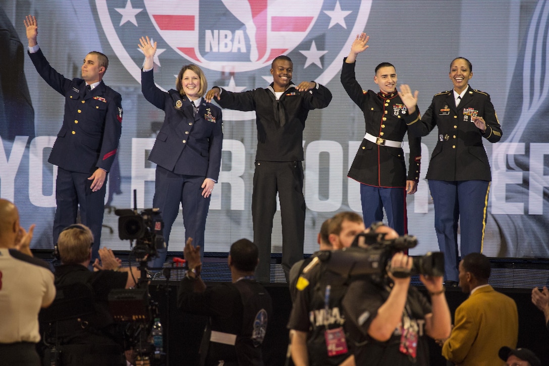 (From left to right) U.S. Coast Guard EM PO2 Stephen Tutweiler, U.S. Air Force Master Sgt. Meagan Parrott, U.S. Navy RP Seaman Richard Montgomery, U.S. Marine Sgt. Efrain Broutan, U.S. Army Sgt. Maj. Fotini Nixon, are recognized for their service during the NBA All-Star Game inside the Smoothie King Center, New Orleans, La., Feb. 16, 2014. The Armed Forces community had the opportunity to participate in the 2014 NBA All-Star Weekend to highlight the military presence in the New Orleans area and support community outreach events. (U.S. Marine Corps photo by Lance Cpl. Mackenzie Schlueter/Released)
