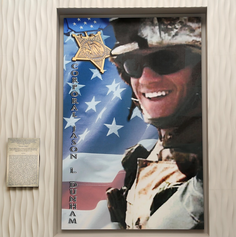 The Cpl. Jason L. Dunham Memorial Mess Hall presents a portrait of in the entrance of the building. The portrait is a permanent fixture, which will stand on the right of his engraved Medal of Honor citation. 
