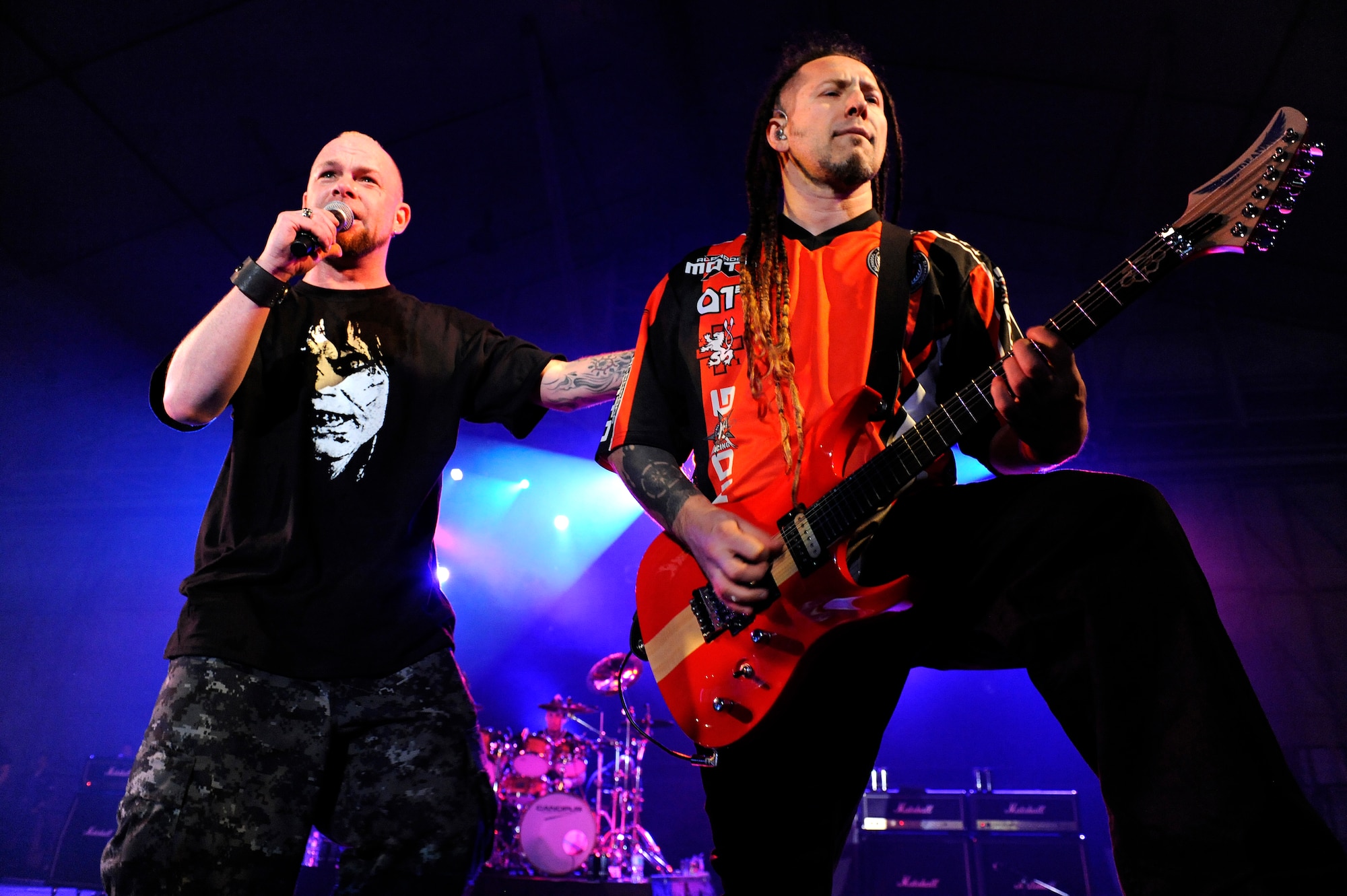Heavy metal band Five Finger Death Punch lead singer, Ivan Moody, and rhythm guitarist, Zoltan Bathory, perform during a concert on Kadena Air Base, Japan, Feb. 16, 2014. During their visit to Kadena, FFDP members met with Airmen during breakfast and lunch meet-and-greets and put on a free concert for U.S. service members on-island. (U.S. Air Force photo by Senior Airman Maeson L. Elleman)