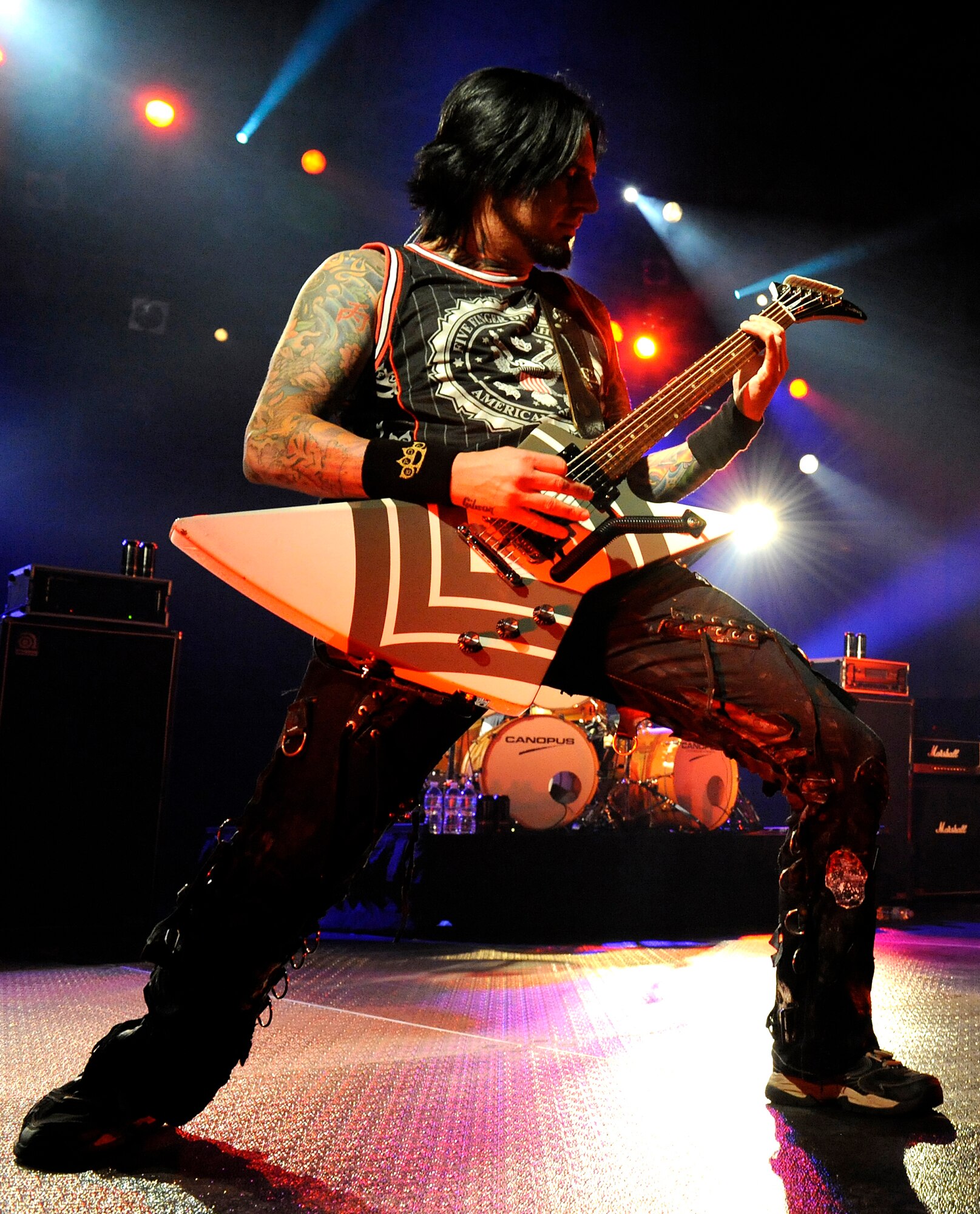 Heavy metal band Five Finger Death Punch guitarist, Jason Hook, plays a guitar solo during a concert on Kadena Air Base, Japan, Feb. 16, 2014. Approximately 3,000 service members attended the free concert, which was sponsored by the 18th Force Support Squadron. (U.S. Air Force photo by Senior Airman Maeson L. Elleman) 