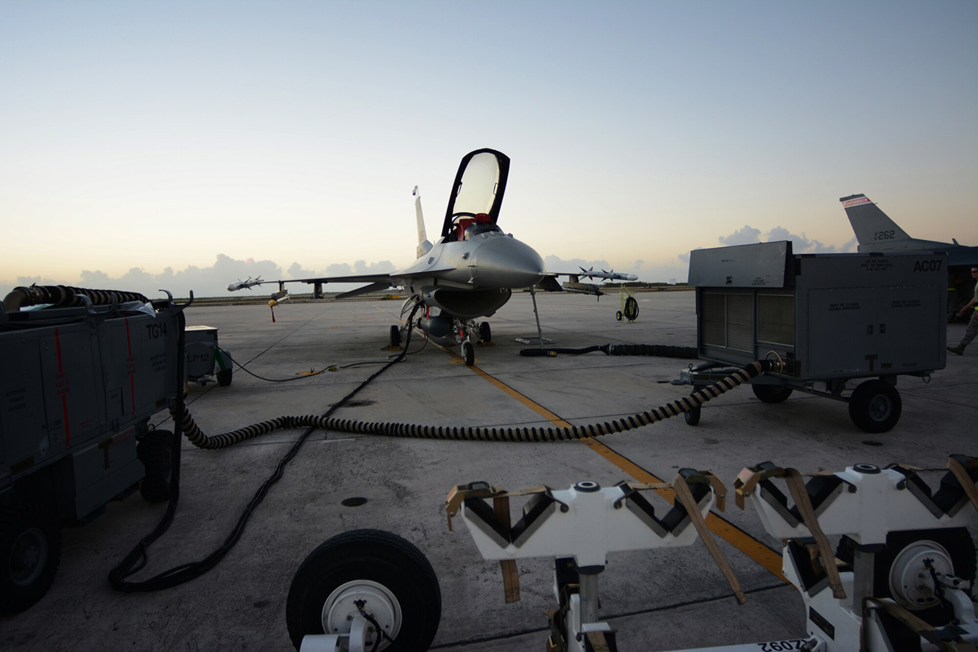 An Air National Guard F-16 Fighting Falcon assigned to the 115th Fighter Wing receives maintenance on the Navy Air Station Key West flightline, Key West, Fla., Feb. 4, 2014. The 115th FW came to Key West in February to reduce the likelihood of flight cancelations due to weather. The deployment allowed pilots to test their expertise against dissimilar aircraft. (Air National Guard photo by Senior Airman Andrea F. Liechti)