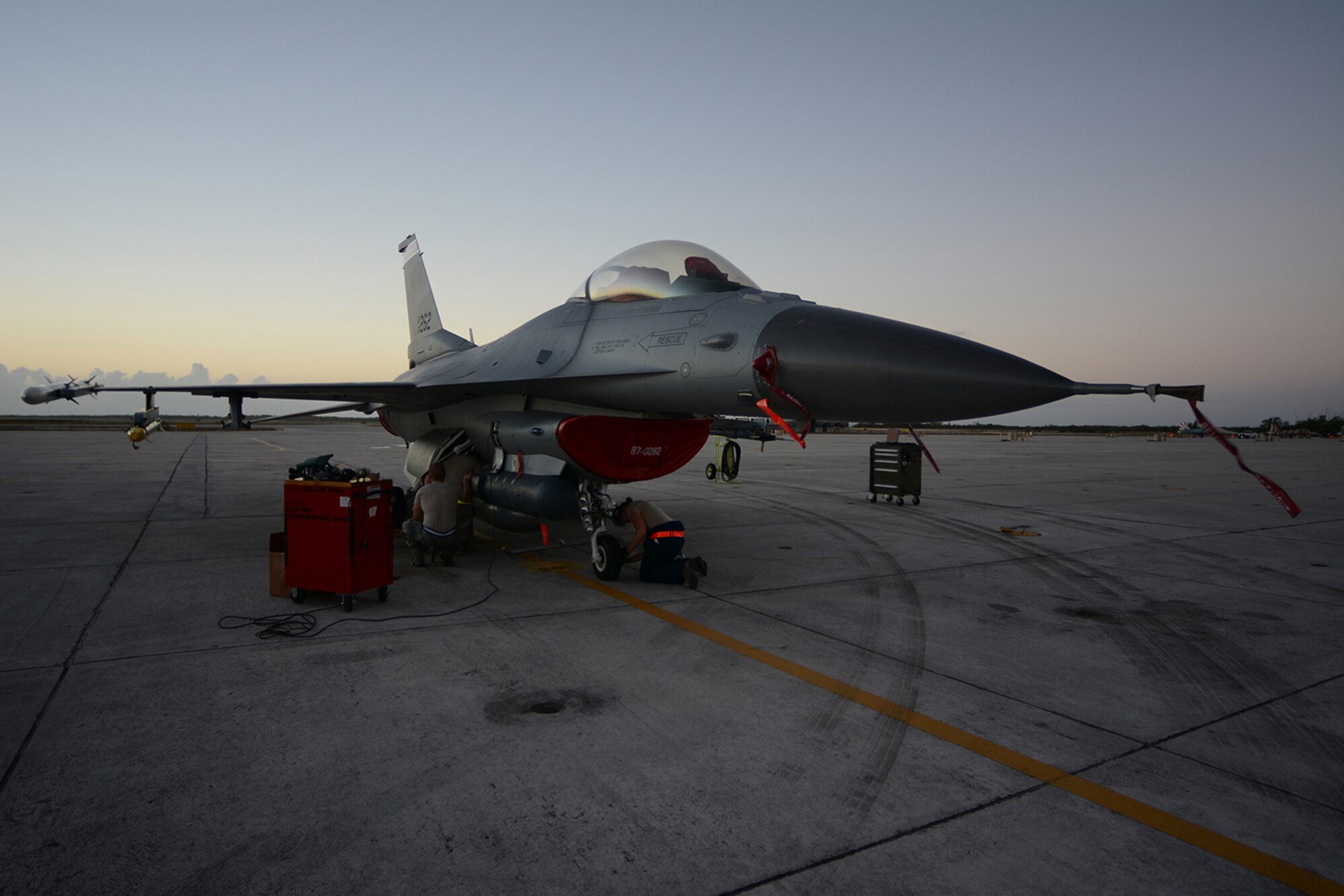 Airmen from the 115th Fighter Wing maintain an F-16 Fighting Falcon on the flightline at Naval Air Station Key West, Key West, Fla., Feb. 4, 2014. More than 100 Airmen were deployed to Key West in support of the flying mission, where 115th FW pilots had the chance to fly against dissimilar aircraft. (Air National Guard photo by Senior Airman Andrea F. Liechti)