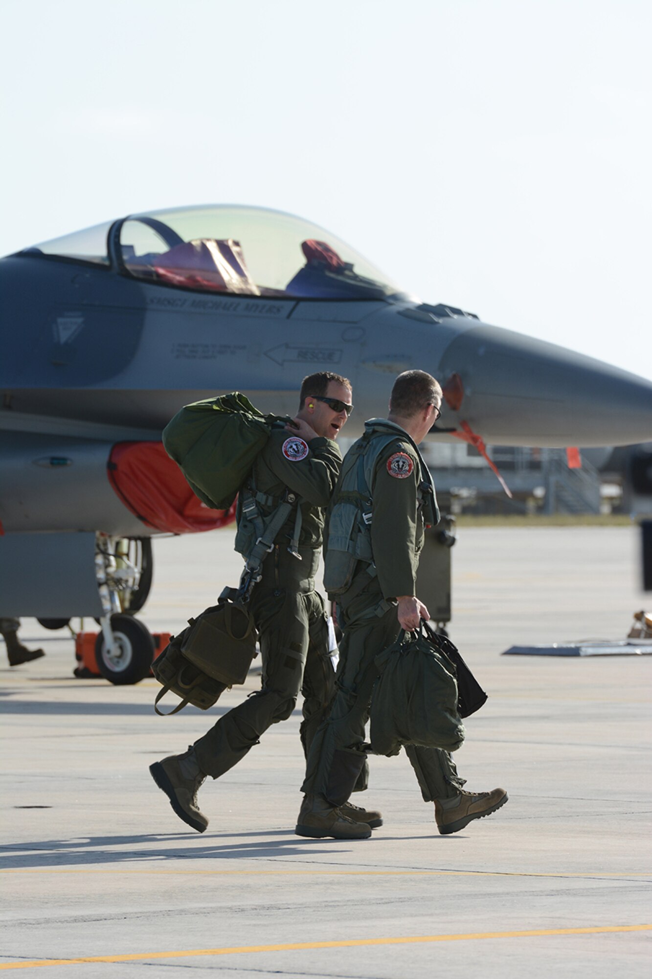 Pilots assigned to the 115th Fighter Wing exit the Naval Air Station Key West following a training exercise near Key West, Fla., Feb. 3, 2014. The 115th FW came to Key West in February to reduce the likelihood of flight cancelations due to weather. The deployment allowed pilots to test their expertise against dissimilar aircraft. (Air National Guard photo by Senior Airman Andrea F. Liechti)