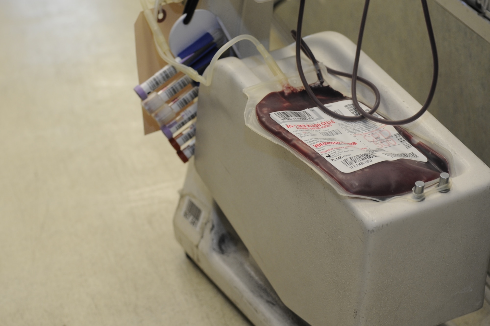 Blood collects in a bag during a blood drive at the 355th Maintenance Group at Davis-Monthan Air Force Base, Ariz. Feb. 14, 2014. The American Red Cross parked a donation truck in a hanger on the flightline, giving maintainers the opportunity to donate blood without taking them away from their duty. (U.S. Air Force photo by Airman 1st Class Betty R. Chevalier/Released)