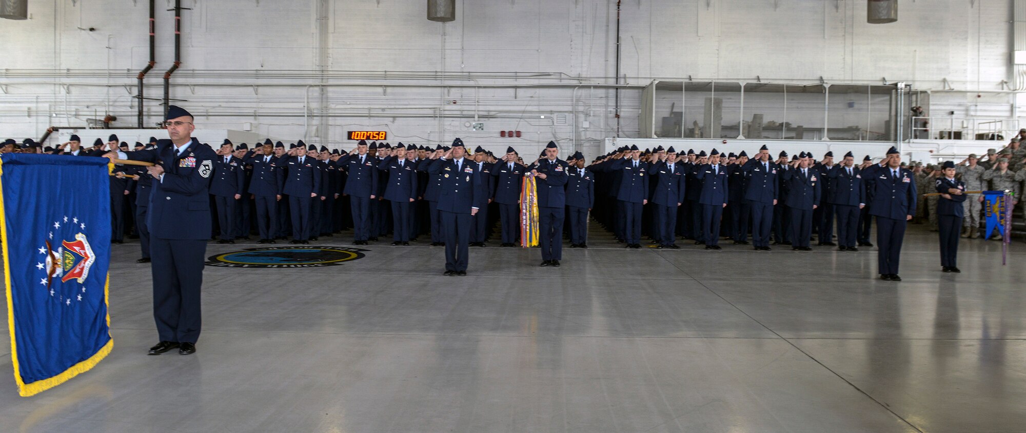 The 366th Fighter Wing stands at attention and salutes during a change-of-command ceremony at Mountain Home Air Force Base, Idaho, Feb. 18, 2014. Col. Dave Iverson assumed command of the 366th FW from Col. Christopher Short. (U.S. Air Force photo by Master Sgt. Kevin Wallace/RELEASED)
