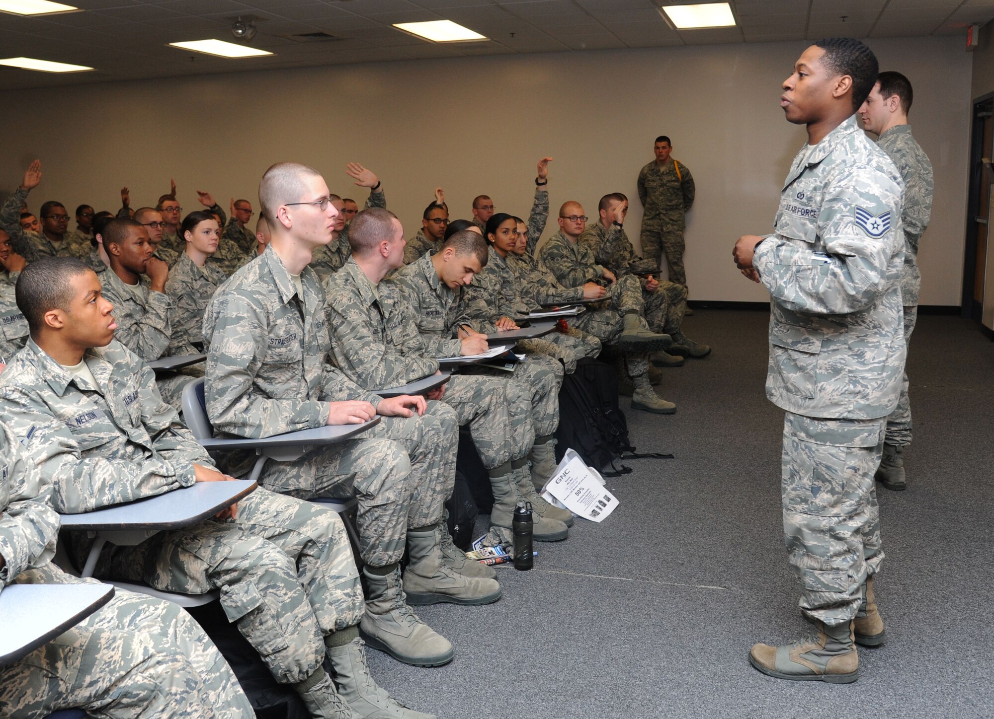 Staff Sgt. Lester Lane III, 334th Training Squadron instructor, speaks to Keesler technical training students during a 5/6 mentoring briefing Feb. 14, 2014, at the Levitow Training Support Facility, Keesler Air Force Base, Miss.  The 5/6 panel, which is made up of staff and technical sergeants, provide a more peer-to-peer atmosphere for the Airmen as they are mentored on deployment expectations, assignments, technical training school requirements, family support and pride in service. (U.S. Air Force photo by Kemberly Groue)