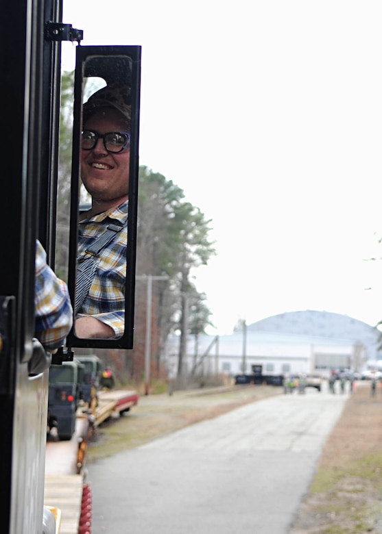 Billy Grimes, 733rd Logistics Readiness Division Utility Rail Branch engineer, moves Humvees for unit training at Fort Eustis, Va., Feb. 7, 2014. In 2013, the 733rd LRD moved 374 rail cars in support of real world missions. (U.S. Air Force photo by Senior Airman Austin Harvill/Released)