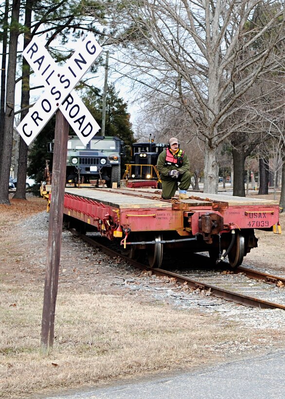 Tom DeRosier, 733rd Logistics Readiness Division Utility Rail Branch engineer, rides along during a "wye" maneuver at Fort Eustis, Va., Feb. 7, 2014. Fort Eustis has had rail operations since World War I. (U.S. Air Force photo by Senior Airman Austin Harvill/Released)