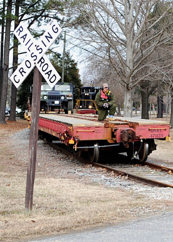 Tom DeRosier, 733rd Logistics Readiness Division Utility Rail Branch engineer, rides along during a "wye" maneuver at Fort Eustis, Va., Feb. 7, 2014. Fort Eustis has had rail operations since World War I. (U.S. Air Force photo by Senior Airman Austin Harvill/Released)