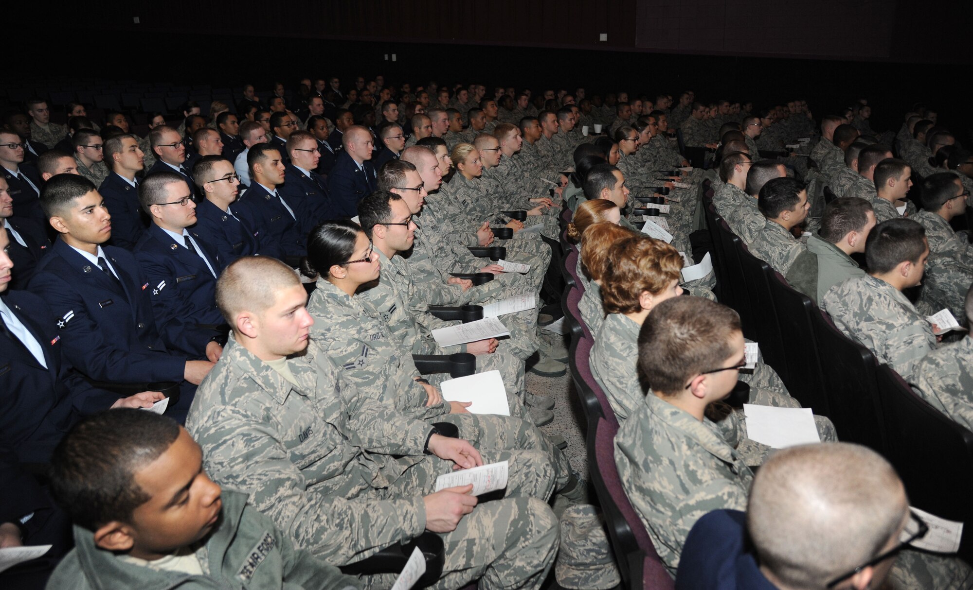 Keesler technical training students listen during a transition briefing Feb. 14, 2014, at the Welch Theater, Keesler Air Force Base, Miss.  The transition briefing is required for all Airmen who are transitioning up to the advanced transition phase (ATP) which allows them to go off base.  It helps reestablish expectations of proper conduct for those Airmen who have displayed proper Airmanship while at Keesler.   (U.S. Air Force photo by Kemberly Groue)