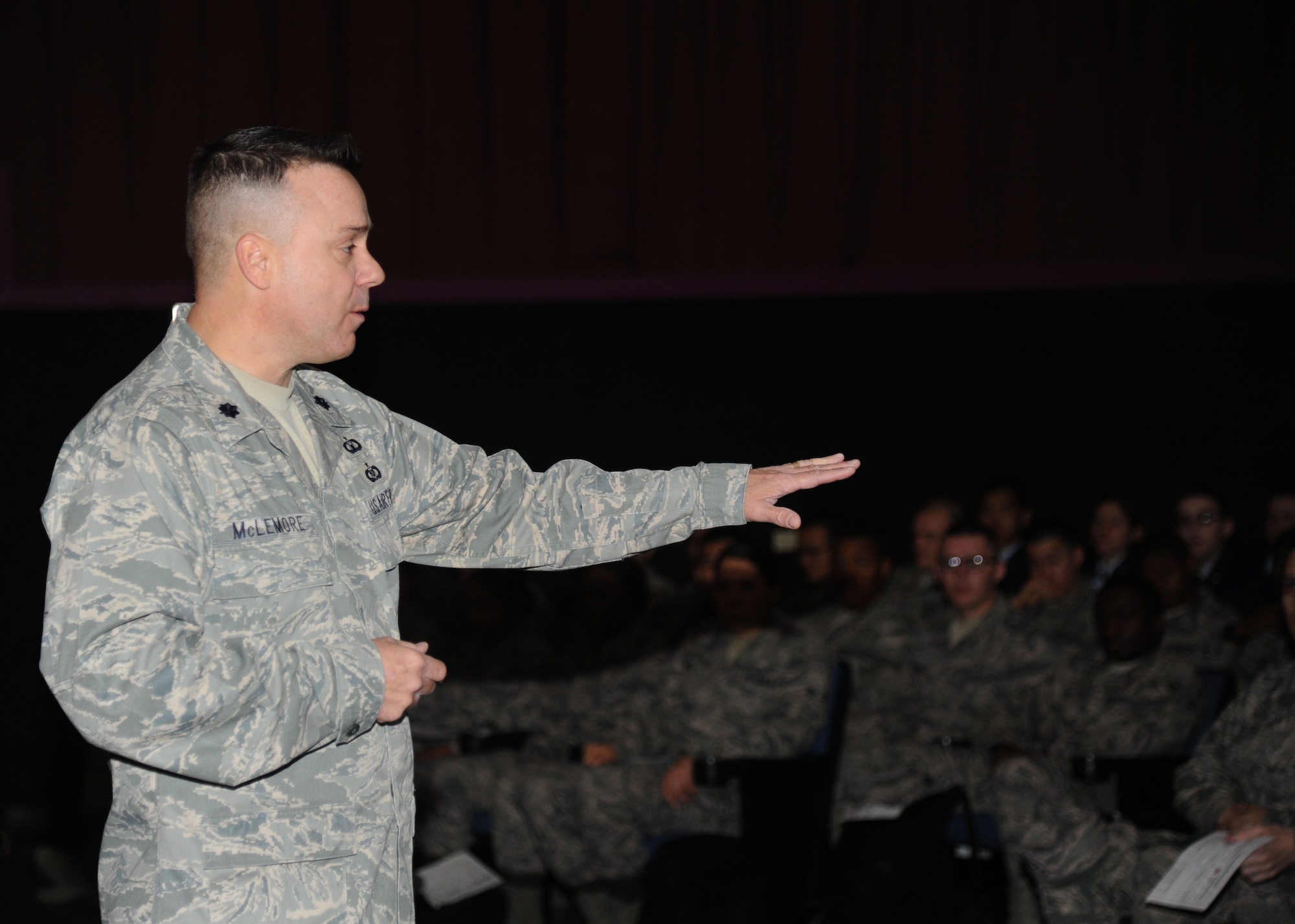 Lt. Col. Jeffrey McLemore, 81st Training Group deputy commander, speaks to technical training students during the transition briefing Feb. 14, 2014, at the Welch Theater, Keesler Air Force Base, Miss.  The transition briefing is required for all Airmen who are transitioning up to the advanced transition phase (ATP) which allows them to go off base.  It helps reestablish expectations of proper conduct for those Airmen who have displayed proper Airmanship while at Keesler. (U.S. Air Force photo by Kemberly Groue)