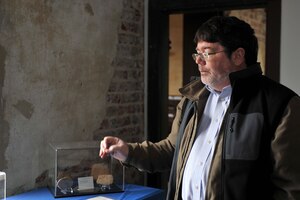 Dr. Christopher McDaid, 733rd Civil Engineer Division environmental element archaeologist, discusses artifacts housed in the Matthew Jones House at Fort Eustis, Va., Feb. 5, 2014. McDaid and the archaeology team work to preserve Fort Eustis’ history through education, restoration and community outreach. McDaid is a native of Bryn Mawr, Pa. (U.S. Air Force photo by Staff Sgt. Katie Gar Ward/Released)