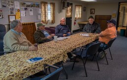 Joint Base Charleston Skeet and Trap Range volunteers discuss the upcoming Open House  Feb. 14, 2014, at the Skeet and Trap Range on Joint Base Charleston – Air Base, S.C. The volunteers were planning the open house to show the JB Charleston community renovations to the Skeet and Trap Range facility. (U.S. Air Force photo/ Airman 1st Class Clayton Cupit)