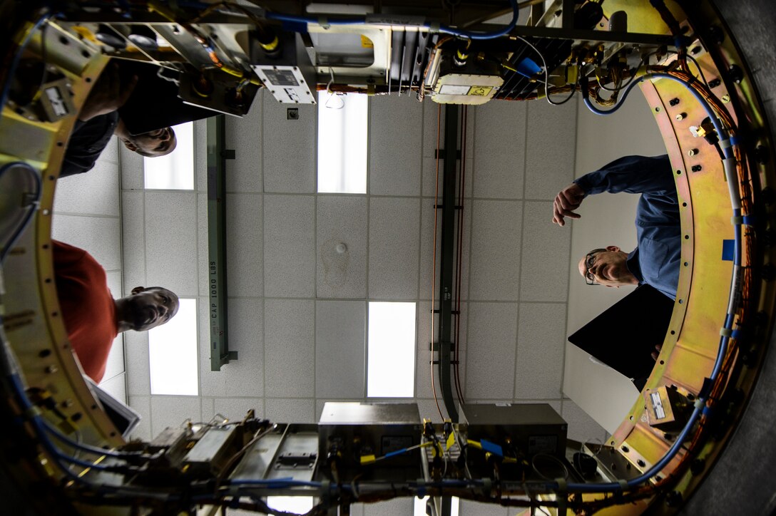 Jeffrey Head, Instrumentation Laboratory supervisor, right, Kevin Jones, Instrumentation Laboratory technician, left, and Richard Thomas, IT, left, go over a MOD-7 instrumentation wafer from a Minuteman III at Vandenberg Air Force Base, Calif., Feb. 3, 2014. The Minuteman IIIs are regularly tested with launches from Vandenberg AFB in order to validate the effectiveness, readiness and accuracy of the weapon system, as well as to support the system's primary purpose - nuclear deterrence. (U.S. Air Force photo by Staff Sgt. Jonathan Snyder/RELEASED)  


