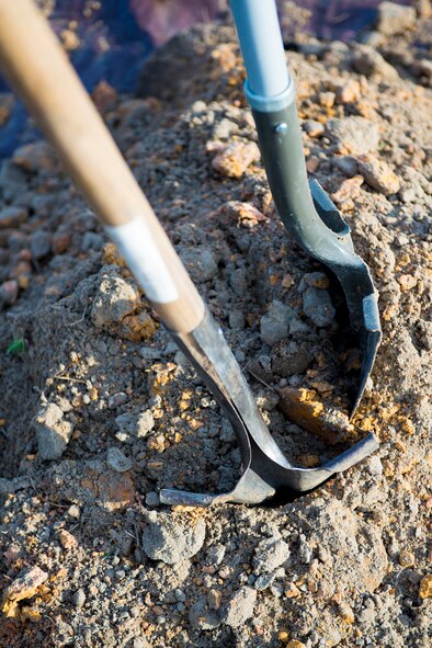 Shovels sit atop a pile of dirt before a tree planting ceremony in remembrance of the crew members of the downed helicopter Jolly 22, an HH-60G Pave Hawk which crashed Jan. 7th on the Norfolk coast of England, at Moody Air Force base, Ga., Feb. 14, 2014. Airmen from the 41st Helicopter Maintenance Unit planted a Crape Myrtle tree and placed an engraved stone along the plants border. (U.S. Air Force photo by Airman 1st Class Ryan Callaghan/Released)
