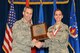 McGHEE TYSON AIR NATIONAL GUARD BASE, Tenn. - Senior Airman Chloe Gunderson, right, receives the John L. Levitow honor award for Airman Leadership School Class 14-2 at the I.G. Brown Training and Education Center from Col. Timothy J. Cathcart, TEC commander, Feb. 12, 2014. The John L. Levitow award is the highest honor awarded a graduate of any Air Force enlisted professional military education course. (U.S. Air National Guard photo by Master Sgt. Kurt Skoglund/Released)
