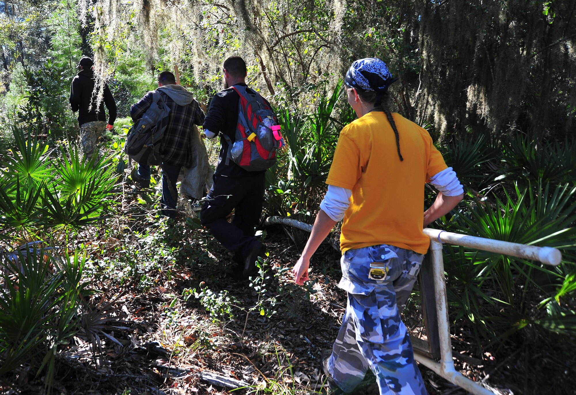 The Prentice Thomas and Associates archeologist team, from Fort Walton Beach, Fla., search for an area to dig a test hole Feb. 14, at Tyndall. The company has had a standing relationship with Tyndall for more than 30 years. For this mission, the team has been trying to expand the boundaries of sites to be registered in the National Register of Historic Places. (U.S. Air Force photo by Airman 1st Class Sergio A. Gamboa)
