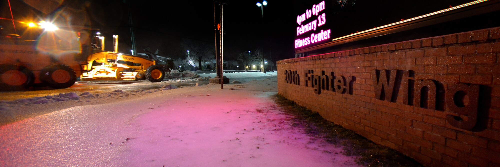 Snow and ice builds up quickly during the night outside of Shaw’s 20th Fighter Wing building, Feb. 12, 2014, Shaw Air Force Base, S.C. As temperatures continued to drop during the night, thick ice formed over Shaw’s roads and sidewalks. As the inclement weather continues, Team Shaw will continue to operate with "Mission Essential Personnel" only until further advised by the 20th Fighter Wing commander. Team Shaw personnel are urged to stay off the roads and use their best judgment if they do have to go out. (U.S. Air Force photo by Staff Sgt. Kenny Holston/Released)