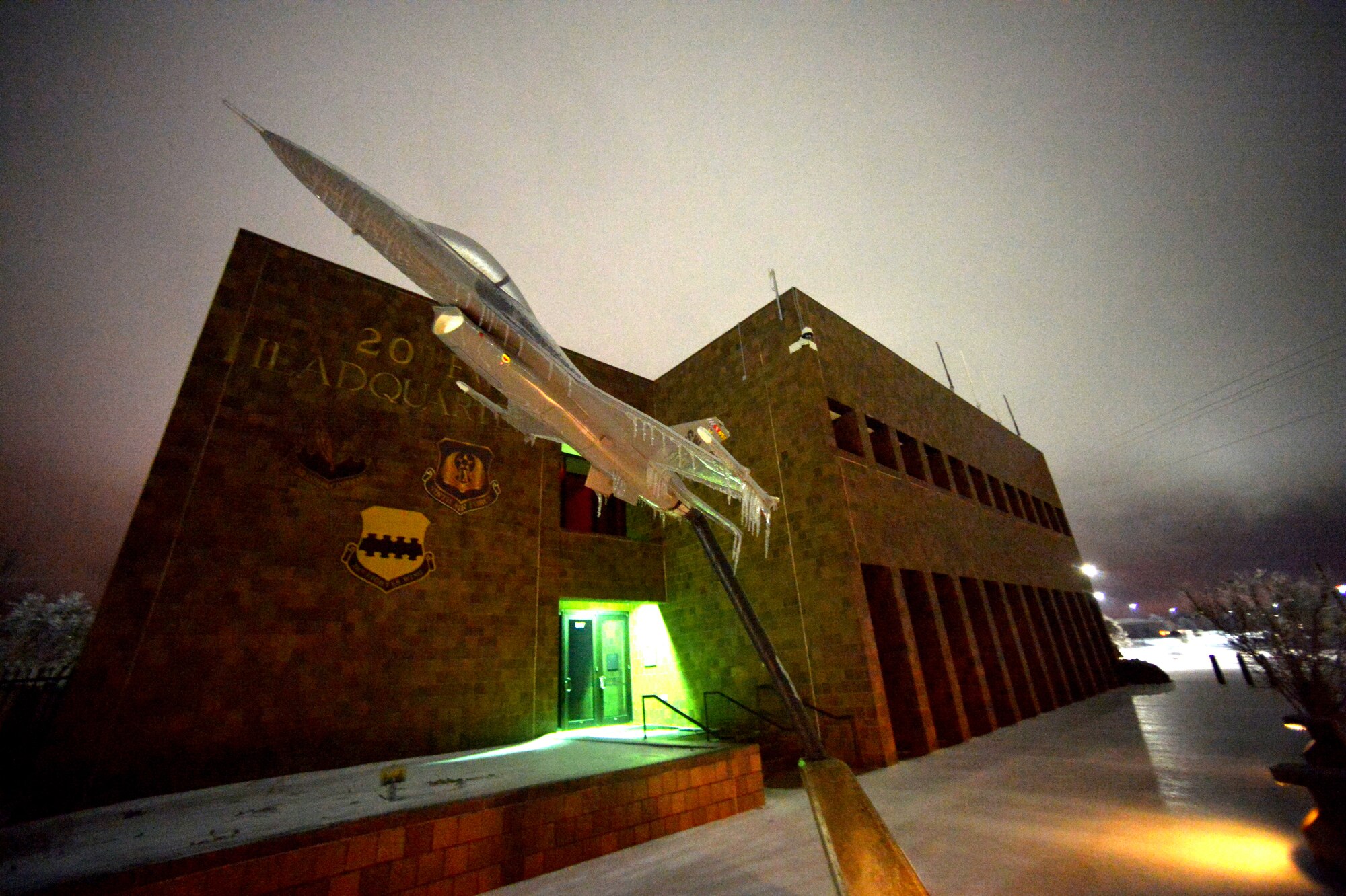 Thick ice and snow set the scene outside of Shaw’s 20th Fighter Wing headquarters building, Feb. 12, 2014, Shaw Air Force Base, S.C. As temperatures continued to drop during the night, thick ice formed over Shaw’s roads and sidewalks. As the inclement weather continues Team Shaw will continue to operate with "Mission Essential Personnel" only until further advised by the 20th Fighter Wing commander. Team Shaw personnel are urged to stay off the roads and use their best judgment if they do have to go out. (U.S. Air Force photo by Staff Sgt. Kenny Holston/Released)