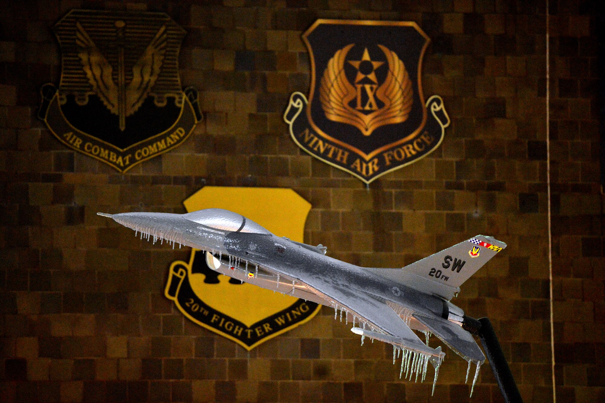 Frigid winter weather causes ice to take over Shaw’s F-16 Fighting Falcon display just outside of the 20th Fighter Wing headquarters building, Feb. 12, 2014, Shaw Air Force Base, S.C. As temperatures continued to drop during the night, thick ice formed over Shaw’s roads and sidewalks. As the inclement weather continues, Team Shaw will continue to operate with "Mission Essential Personnel" only until further advised by the 20th Fighter Wing commander. Team Shaw personnel are urged to stay off the roads and use their best judgment if they do have to go out. (U.S. Air Force photo by Staff Sgt. Kenny Holston/Released)