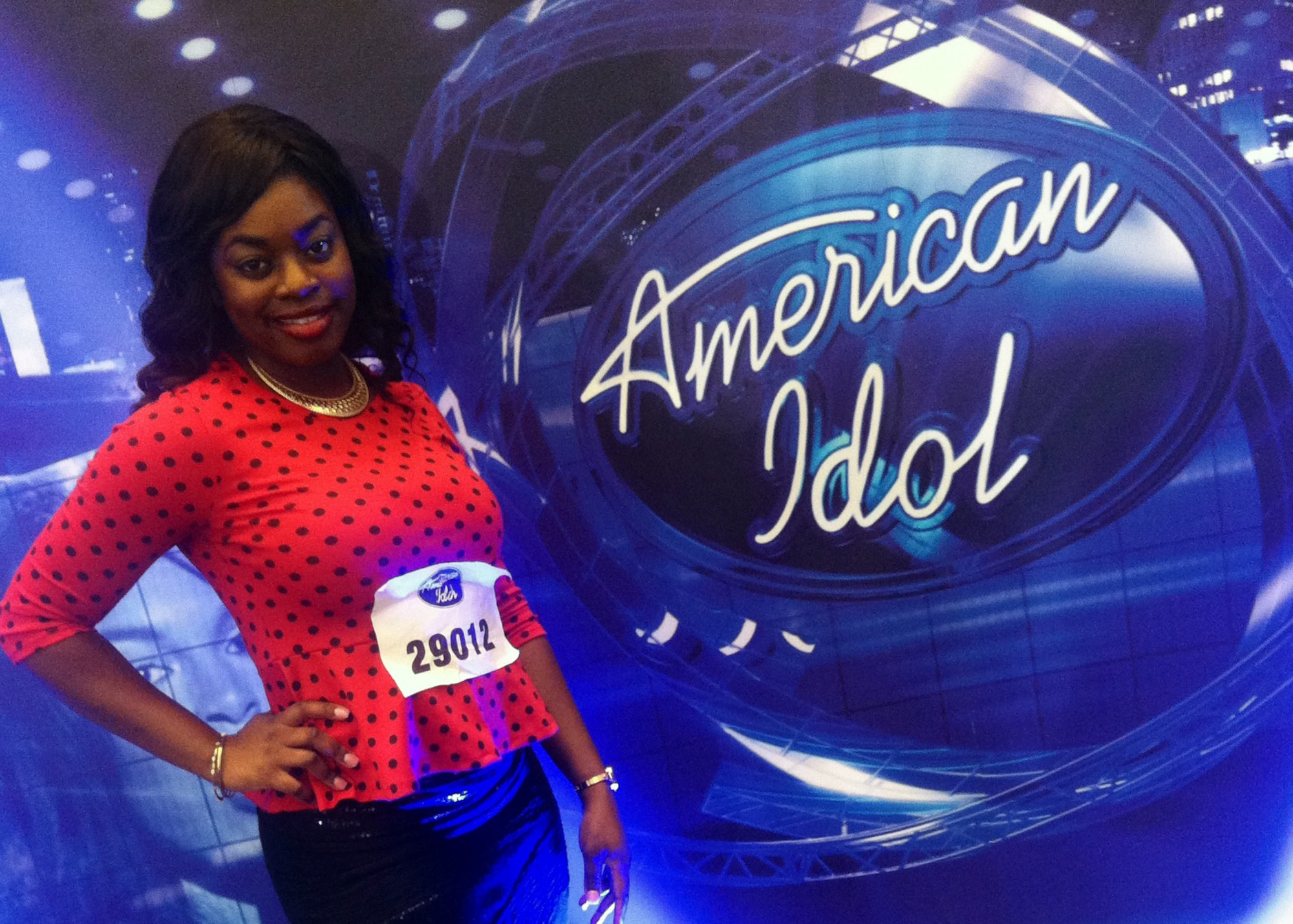 U.S. Air Force Senior Airman Paula Hunt, a vocalist with the U.S. Air Force Heartland of America Band at Offutt Air Force Base, Neb. poses next to the American Idol sign on Oct. 14 in Omaha, Neb. after she was advanced to the final audition of American Idol’s Hollywood Week. 