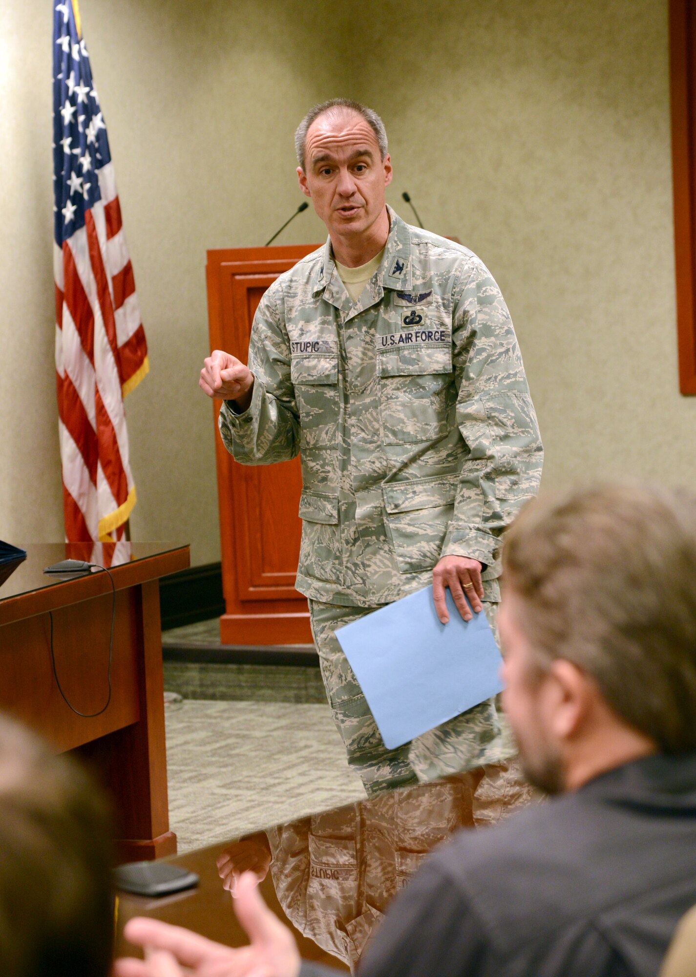 Col. Joseph Stupic, deputy director of the Engineering and Technical Management Directorate, gives opening remarks in a Feb. 6 ceremony honoring 12 graduates in the Long Term Training and Master of Science in Industrial Engineering programs. (Air Force photo by Kelly White) 