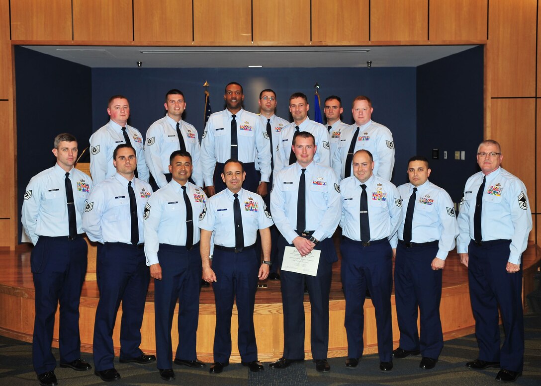 Fourteen Team Tyndall technical sergeants graduated from the Airey NCO Academy Feb. 14 in the academy auditorium. (U.S. Air Force photo by Airman 1st Class Dustin Mullen) 	