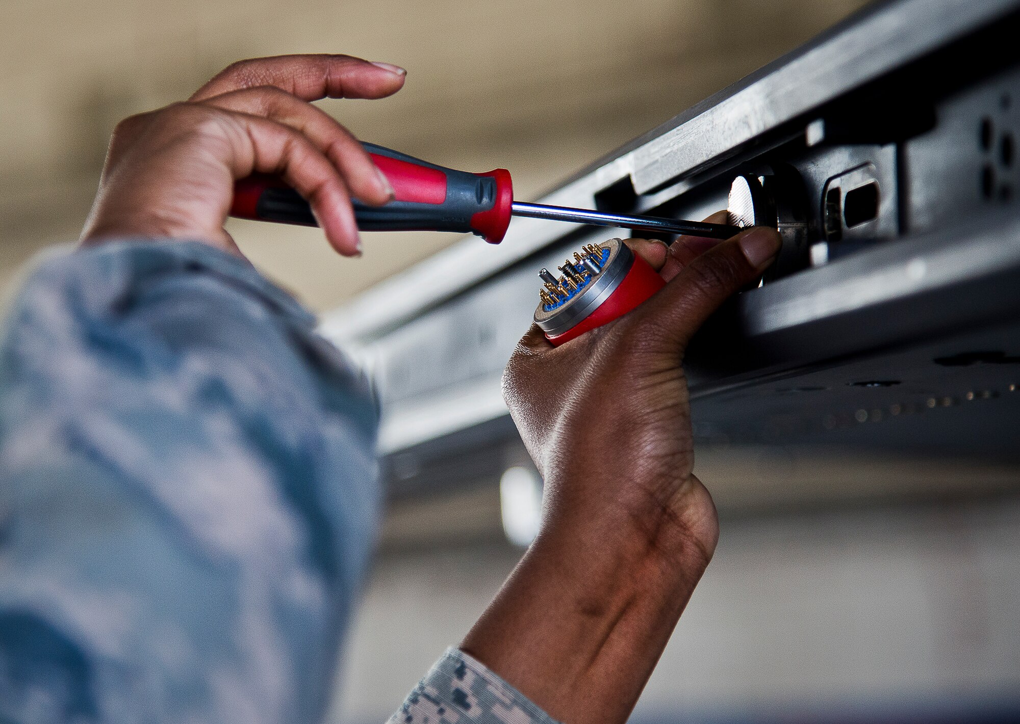 Airman 1st Class Quionjay Jackson, of the 96th Aircraft Maintenance Squadron Blue, prepares an F-16 Fighting Falcon during the annual weapons load crew of the year competition Feb. 14 at Eglin Air Force Base, Fla.  Teams from AMU Blue battled AMU Red in loading a GBU, AIM-9 and an AIM-120 on their respective aircraft.  The winners will be announced at the 96th Maintenance Group banquet.  (U.S. Air Force photo/Samuel King Jr.)