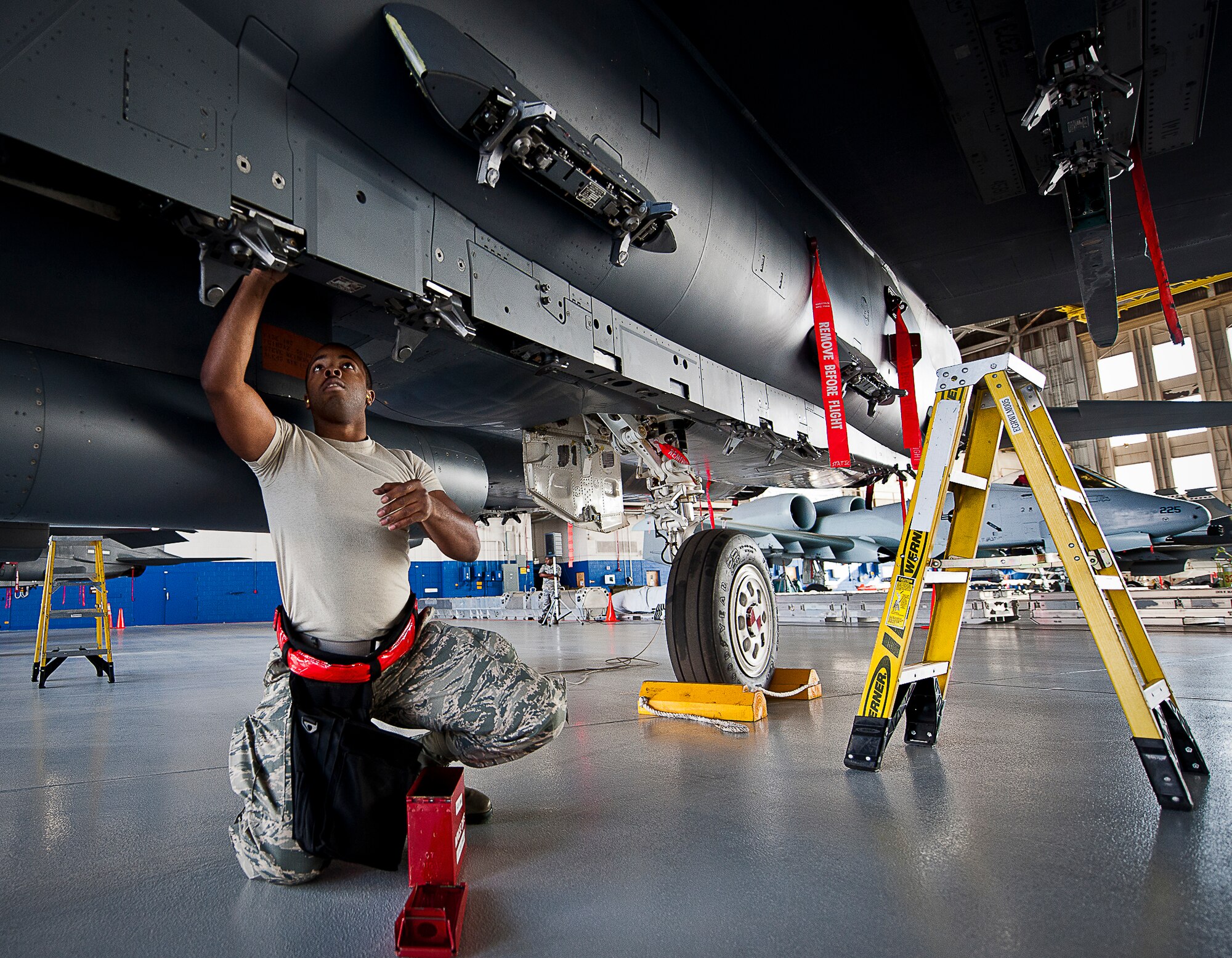 Senior Airman Luis Cleveland, of the 96th Aircraft Maintenance Squadron Red, prepares an F-15 Eagle during the annual weapons load crew of the year competition Feb. 14 at Eglin Air Force Base, Fla.  Teams from AMU Blue battled AMU Red in loading a GBU, AIM-9 and an AIM-120 on their respective aircraft. The winners will be announced at the 96th Maintenance Group banquet.  (U.S. Air Force photo/Samuel King Jr.)