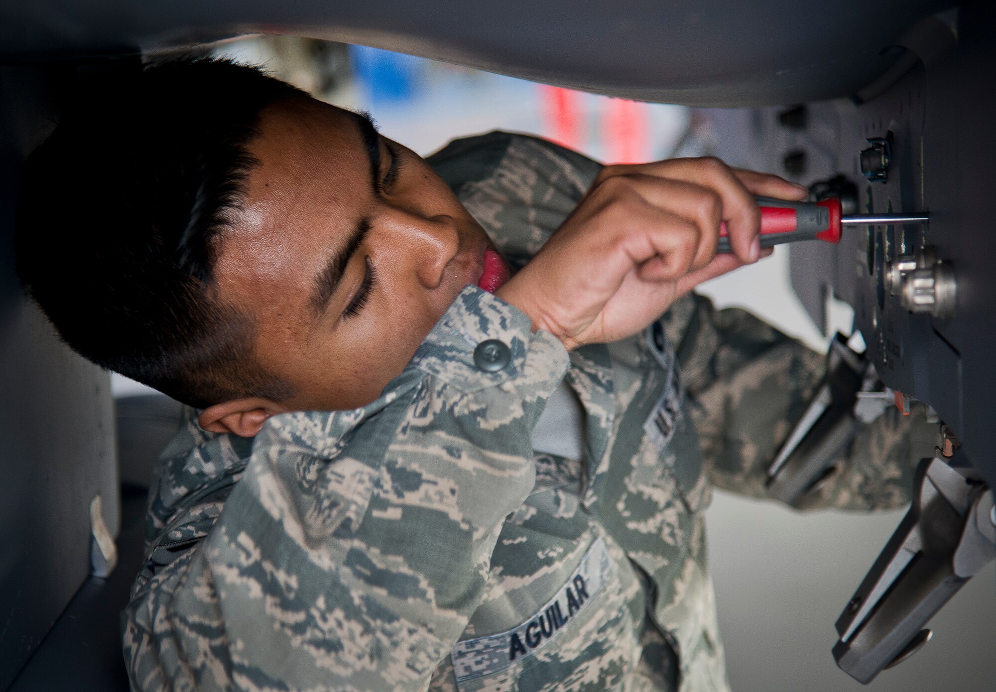 Senior Airman Marqwilliam Aguilar, of the 96th Aircraft Maintenance Squadron Red, prepares his F-15 Eagle during the annual weapons load crew of the year competition Feb. 14 at Eglin Air Force Base, Fla.  Teams from AMU Blue battled AMU Red in loading a GBU, AIM-9 and an AIM-120 on their respective aircraft.  The winners will be announced at the 96th Maintenance Group banquet.  (U.S. Air Force photo/Samuel King Jr.)