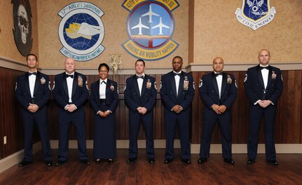 Joint Base Charleston’s newest chief master sergeants celebrate Feb 8, 2014, during the Chief Recognition Ceremony at the Charleston Club at Joint Base Charleston – Air Base, S.C. The seven Airmen were inducted into the Air Force’s senior enlisted rank during the formal event. Chief master sergeants make up one percent of the Air Force's enlisted force. From left to right, Chief Master Sgt. John Kornuta, 315th Aircraft Maintenance Squadron superintendent, Chief Master Sgt. Mark Henriquez, 14th Airlift Squadron superintendent, Chief Master Sgt. Mauree Powell, 437th Maintenance Squadron first sergeant, Senior Master Sgt. Robert Grimsley, 315th Security Forces Squadron manager, Senior Master Sgt. Craig Straw, 628th Logistics Readiness Squadron superintendent, Benjamin Manalastas, 628th Comptroller Squadron superintendent and Robert Schultz, 437th Aerial Port superintendent. (U.S. Air Force photo/Staff Sgt. William O’Brien)