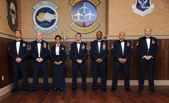 Joint Base Charleston’s newest chief master sergeants celebrate Feb 8, 2014, during the Chief Recognition Ceremony at the Charleston Club at Joint Base Charleston – Air Base, S.C. The seven Airmen were inducted into the Air Force’s senior enlisted rank during the formal event. Chief master sergeants make up one percent of the Air Force's enlisted force. From left to right, Chief Master Sgt. John Kornuta, 315th Aircraft Maintenance Squadron superintendent, Chief Master Sgt. Mark Henriquez, 14th Airlift Squadron superintendent, Chief Master Sgt. Mauree Powell, 437th Maintenance Squadron first sergeant, Senior Master Sgt. Robert Grimsley, 315th Security Forces Squadron manager, Senior Master Sgt. Craig Straw, 628th Logistics Readiness Squadron superintendent, Benjamin Manalastas, 628th Comptroller Squadron superintendent and Robert Schultz, 437th Aerial Port superintendent. (U.S. Air Force photo/Staff Sgt. William O’Brien)
