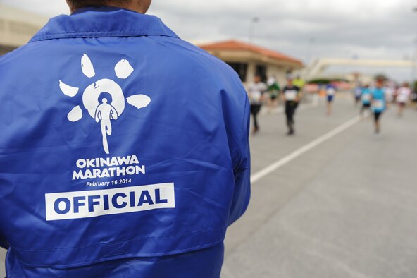 Participants make their way through the 2.8 km base portion of the 2014 Okinawa Marathon on Kadena Air Base, Japan, Feb. 16, 2014. More than 11,000 participants signed up for the 2014 Okinawa Marathon with over 300 military participants running in the race and more than 500 volunteers assisting runners during the on-base portion. (U.S. Air Force photo by Airman 1st Class Keith James) 