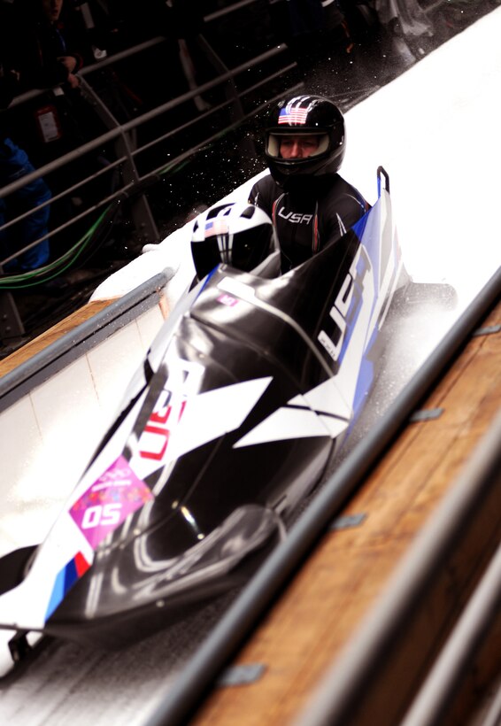 U.S. Army World Class Athlete Program bobsledder Capt. Chris Fogt, right, nears the finish of his fourth run aboard USA-2 with driver Cory Butner in Olympic two-man bobsled competition at Sanki Sliding Centre in Krasnaya Polyana, Russia, Feb. 17, 2014. They finished 12th in the event with a four-run cumulative time of 3 minutes, 47.19 seconds. 