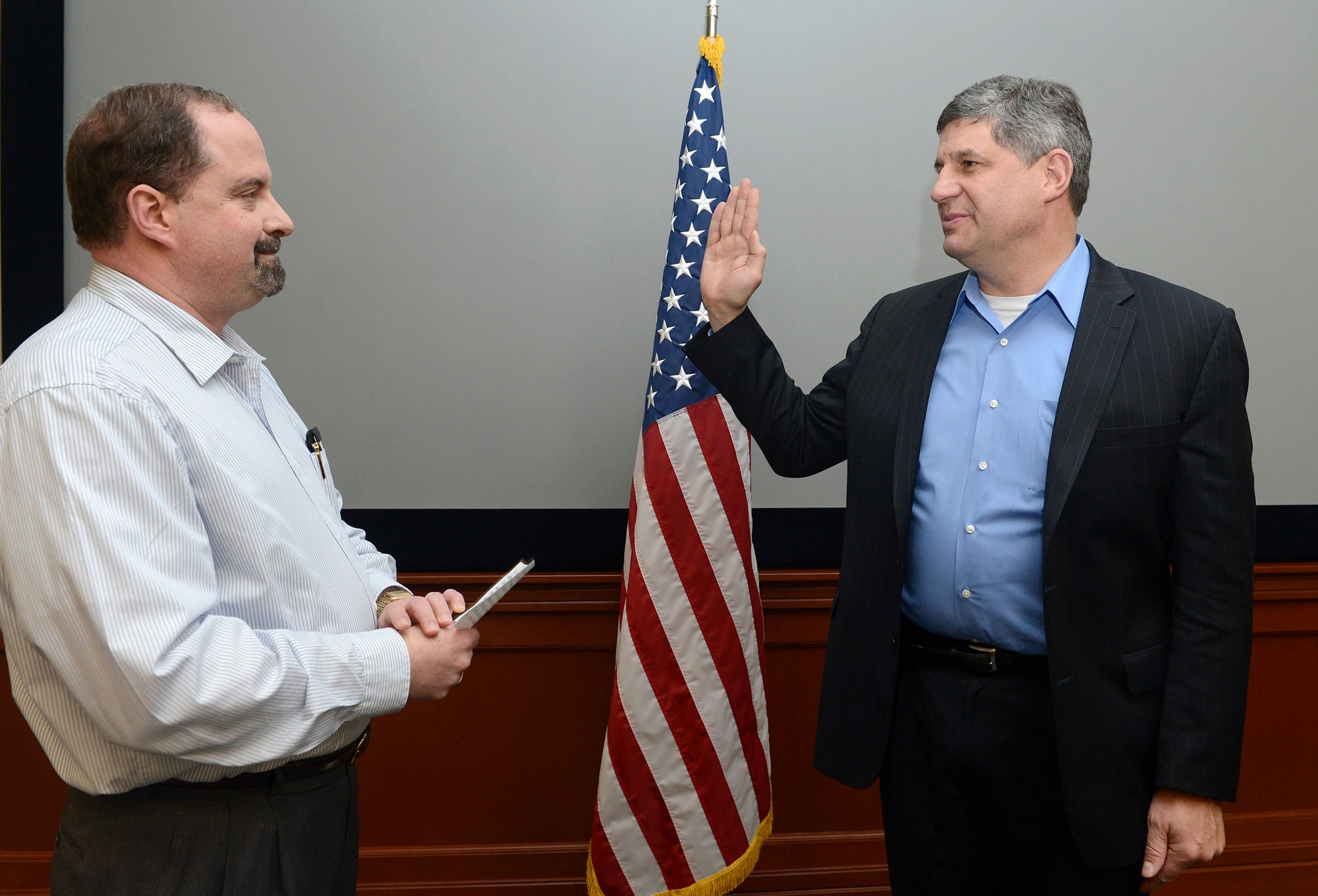 Dr. Bill A. LaPlante is sworn in as the new Principal Deputy, Assistant Secretary of the Air Force for Acquisition by Timothy Beyland, the administrative assistant to the Secretary of the Air Force, Feb. 18, 2014, at MacDill Air Force Base, Fla.  The confirmation makes LaPlante the first confirmed acquisition senior leader since the position became vacant with the departure of David Van Buren in March 2012.  (U.S. Air Force photo/Scott M. Ash)