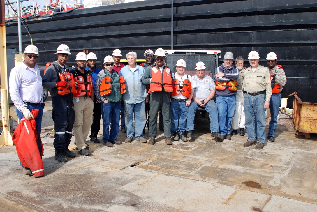 Ensley Engineer Yard and Marine Maintenance Center's Plant Section in operation. Crew prepares for safety meeting preceding the undocking of Revetment Mooring Barge 7401. From L to R:  Gerald Townsell, Royalle Woods, Shawn Morgan, Terrance Knowlton, Levin Collins, Ray Boice, Richard Perfetti, Earl Washington, Robert Woods, Brian Libby, Guy Nadler, Ken Greenwalt, Jack Wilkerson, Richard Qualls, and Ed Blake. (USACE Photo/Brenda Beasley)