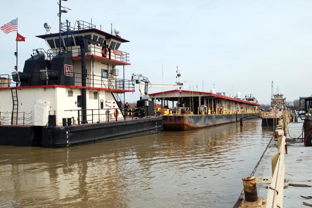 Ensley Engineer Yard and Marine Maintenance Center's Plant Section in operation. Motor Vessel Lusk and Motor Vessel Strong face up on both ends of the Revetment Mooring Barge 7401 removing it from dry dock 5801. (USACE Photo/Brenda Beasley)

