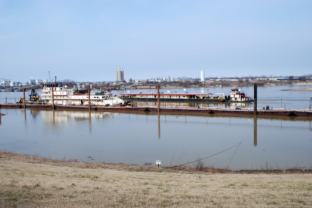 Ensley Engineer Yard and Marine Maintenance Center's Plant Section in operation. Mooring barge being towed into place after coming off dry dock 5801. (USACE Photo/Brenda Beasley)