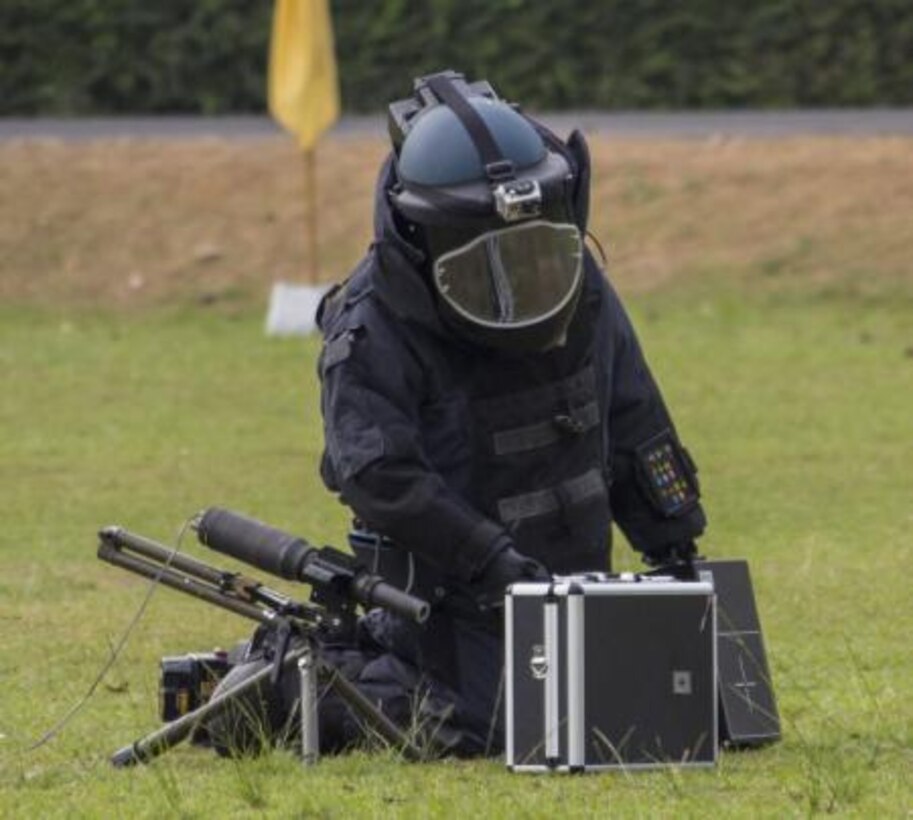 A Royal Thai Air Force explosive ordnance technician places a water shot next to a simulated improvised explosive device during the counter weapons of mass of destruction exercise aboard Wing One Royal Thai Air Force Base, Nakhon Ratchasima, Kingdom of Thailand, Feb. 16 during Exercise Cobra Gold 2014. CG 14 is a joint, multinational exercise conducted annually in the Kingdom of Thailand aimed at enhancing and increasing mission readiness and multinational interoperability.


