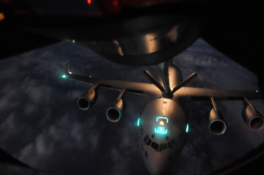 A U.S. Air Force KC-135 Stratotanker from the 909th Air Refueling Squadron stationed at Kadena Air Base, Japan, refuels a U.S. Air Force C-17 Globemaster III from the 437th Airlift Wing, Joint Base Charleston, S.C., in support of exercise Cobra Gold 2014. In its 33rd iteration, Cobra Gold is designed to advance regional security by exercising a robust multinational force from nations sharing common goals in the Asia-Pacific region. (U.S. Air Force photo by Airman 1st Class Keith James)