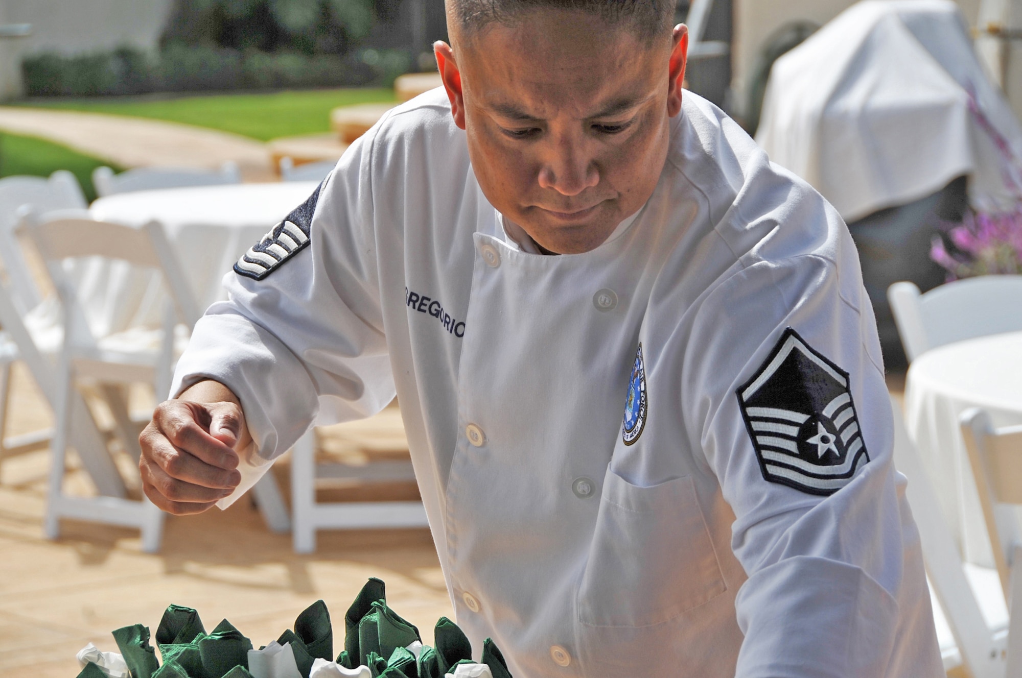 Master Sergeant Jessie Gregorio Master Sergeant Jessie Gregorio puts the finishing touches on food to be served at a party. (Photo by Sarah Corrice) (Photo by Sarah Corrice)