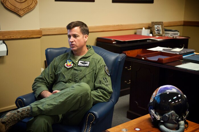 Brig. Gen. Charles Moore, 57th Wing commander, reflects on his time at Nellis Air Force Base, Nev., Feb. 14, 2014. The 57th WG provides advanced aerospace training to world-wide combat air forces and showcases aerospace power to the world. Additionally, the wing conducts advanced aircrew, space, logistics and command and control training through the USAF Weapons School and Red Flag exercises. (U.S. Air Force photo by Lorenz Crespo)