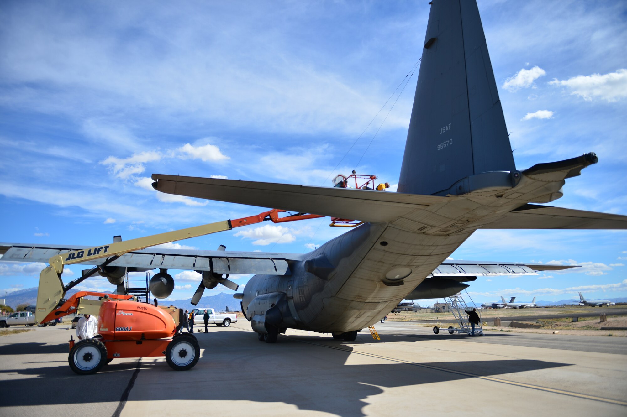 Personnel from the 309th Aerospace Maintenance and Regeneration Group begin prepping the AC-130H Spectre gunship "Bad Company" for transport to the boneyard at Davis-Monthan Air Force Base, Ariz., Feb. 7, 2014. Bad Company will remain at the boneyard until it is either scrapped and used for parts or regenerated and put back into the air. (U.S. Air Force photo/ Senior Airman Eboni Reece)