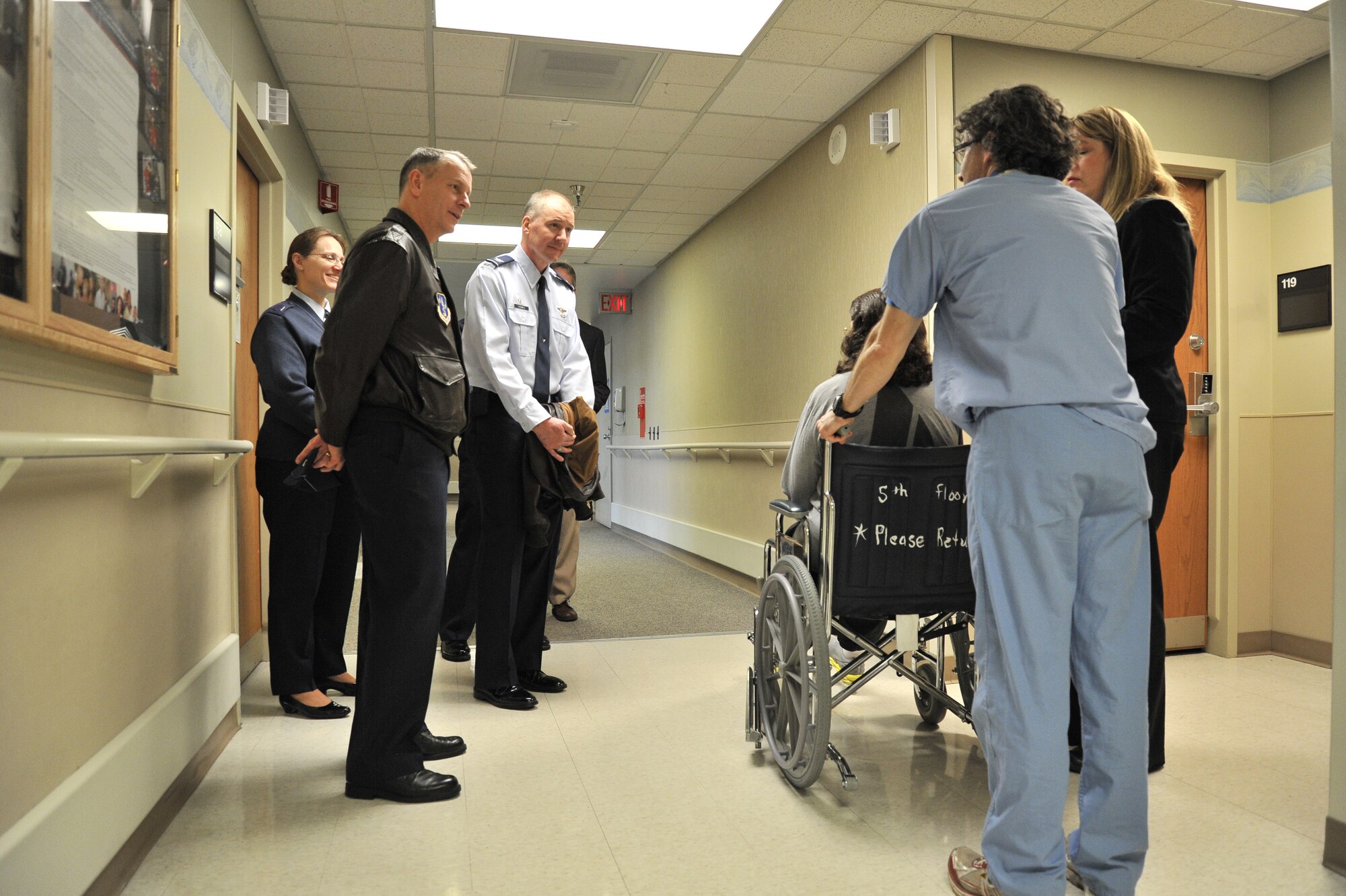 Col. Daniel Swain, the 141st Air Refueling Wing commander (left) and Col. William Thomas the 336th Training Group commander (right), stop and talk with a veteran patient during their tour of the Spokane Veterans Affairs Medical Center facilities in Spokane, Wash., Feb. 14, 2014. The Spokane VAMC is dedicated to providing quality health care services to veterans. In carrying out this mission, the VAMC focuses on providing primary and secondary care, with emphasis on preventive health and chronic disease management. Sharing agreements exist with the 92nd Medical Group at Fairchild AFB, Indian Health Services for Native Americans, and the Idaho and Washington State Departments of Veterans Affairs for the care of state home residents in Lewiston, Idaho, and Spokane. (U.S. Air Force photo by Staff Sgt. Alexandre Montes/Released) 