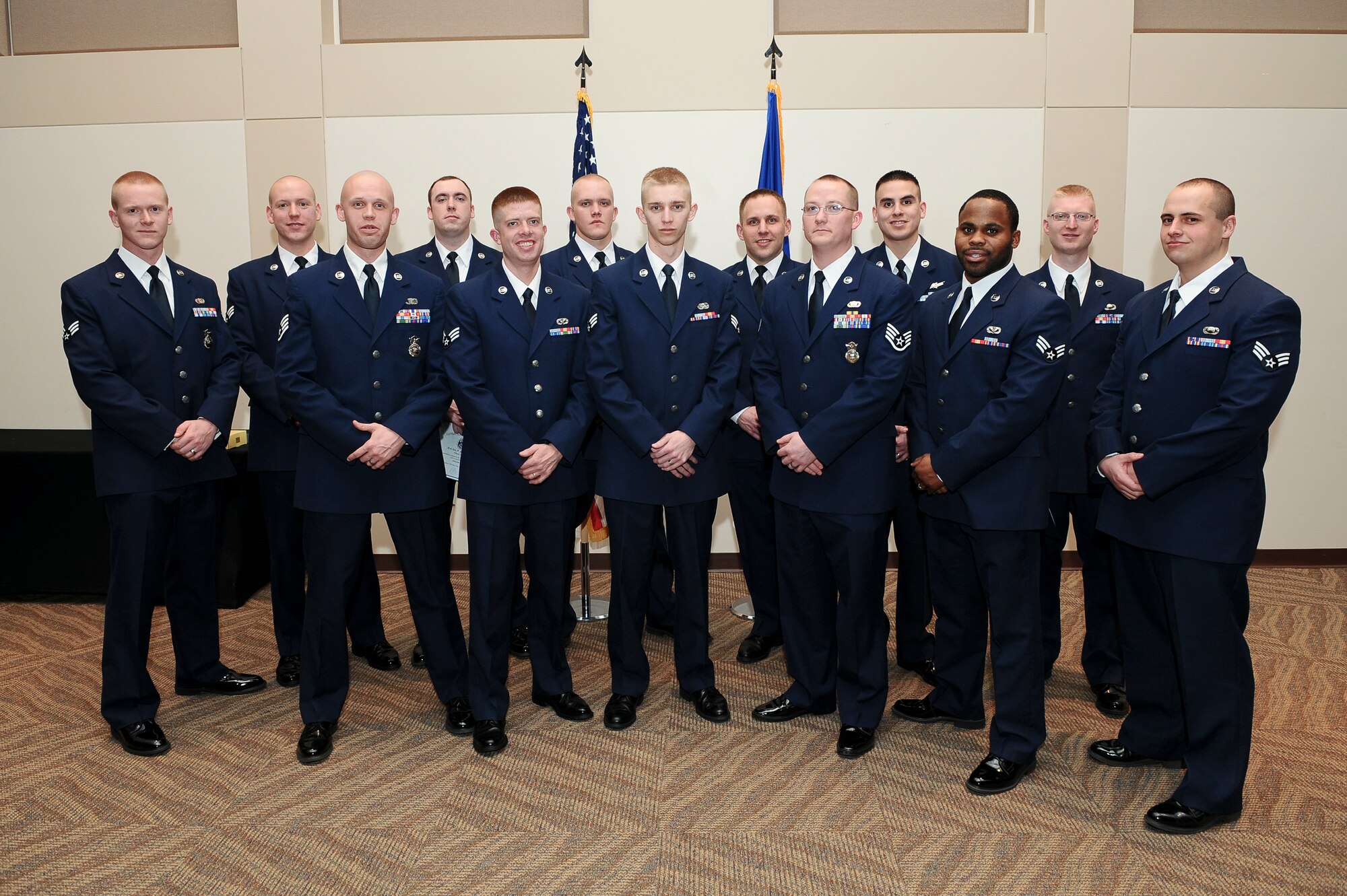 Buckley Airman Leadership School Class 14-B stand together after their graduation Feb. 13, 2014, at the Leadership Development Center on Buckley Air Force Base, Colo. This graduation represents an important part of the enlisted force professional military education, teaching valuable skills required for supervisors. (U.S. Air Force photo by Senior Airman Phillip Houk/Released)